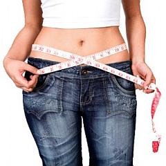 woman measuring stomach with tape measure