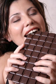 woman eating dark chocolate