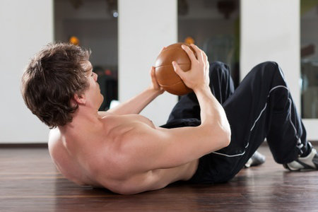 man holding gym ball