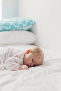 baby sleeping blue and white pillow