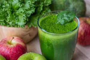 green drink with green vegetables and apples