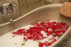 bathtub with flowers floating