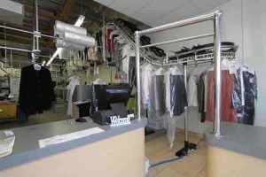 clothes hanging in a dry cleaning shop